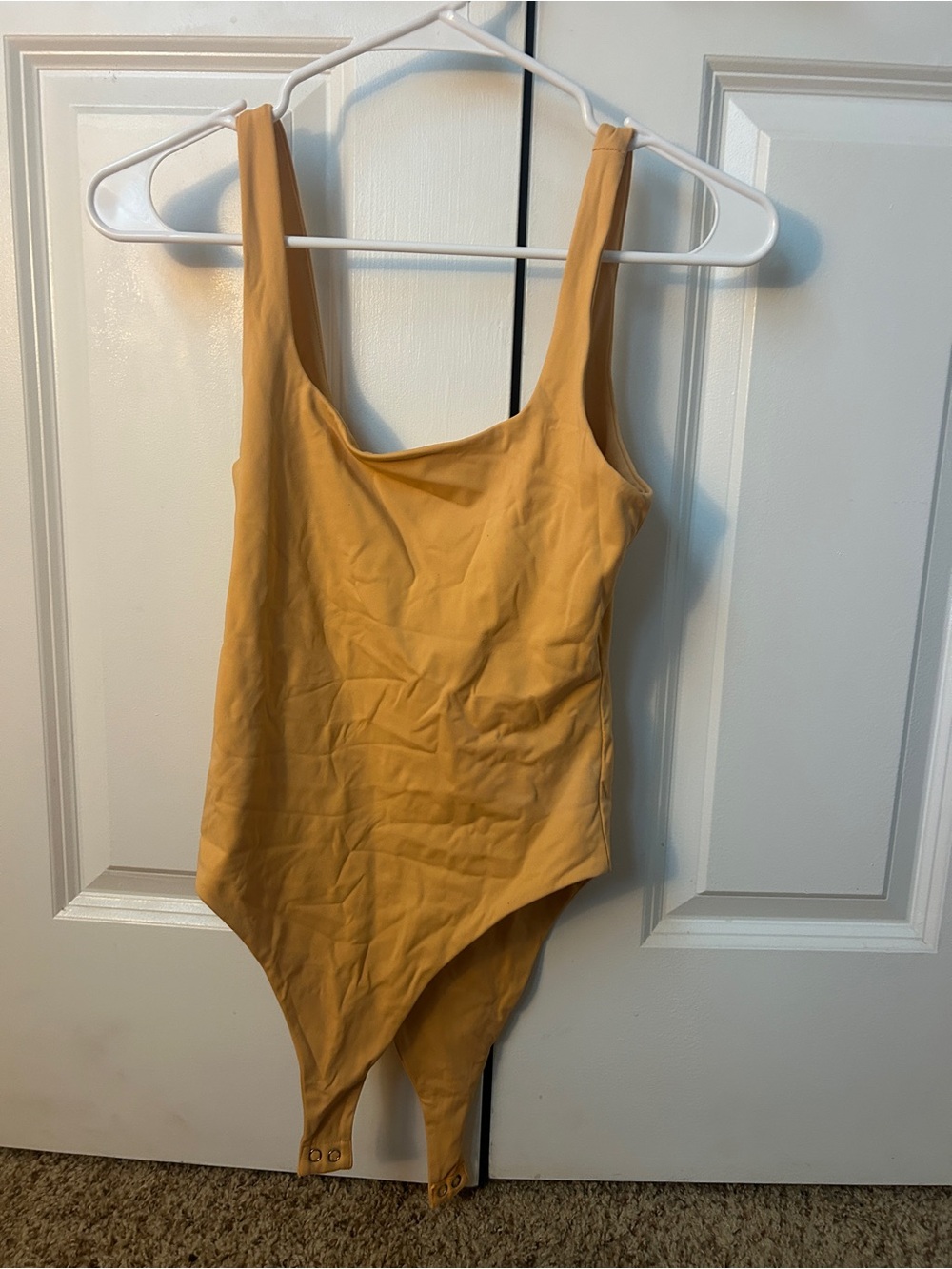 Pale orange bodysuit